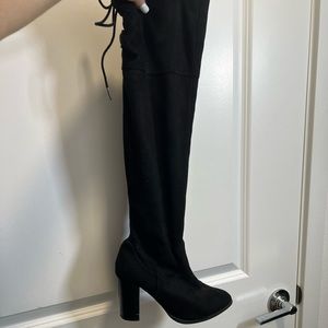 Black knee high heeled boots